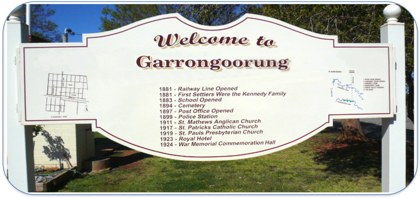 large white wooden sign which says