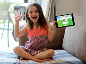 Child Account: young girl playing on an iPad.